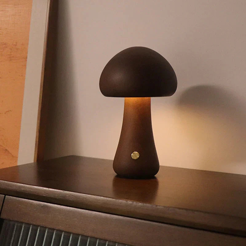 Handcrafted wooden mushroom LED night light, GlowShroom, enhances kids' decor with its warm, soothing glow.