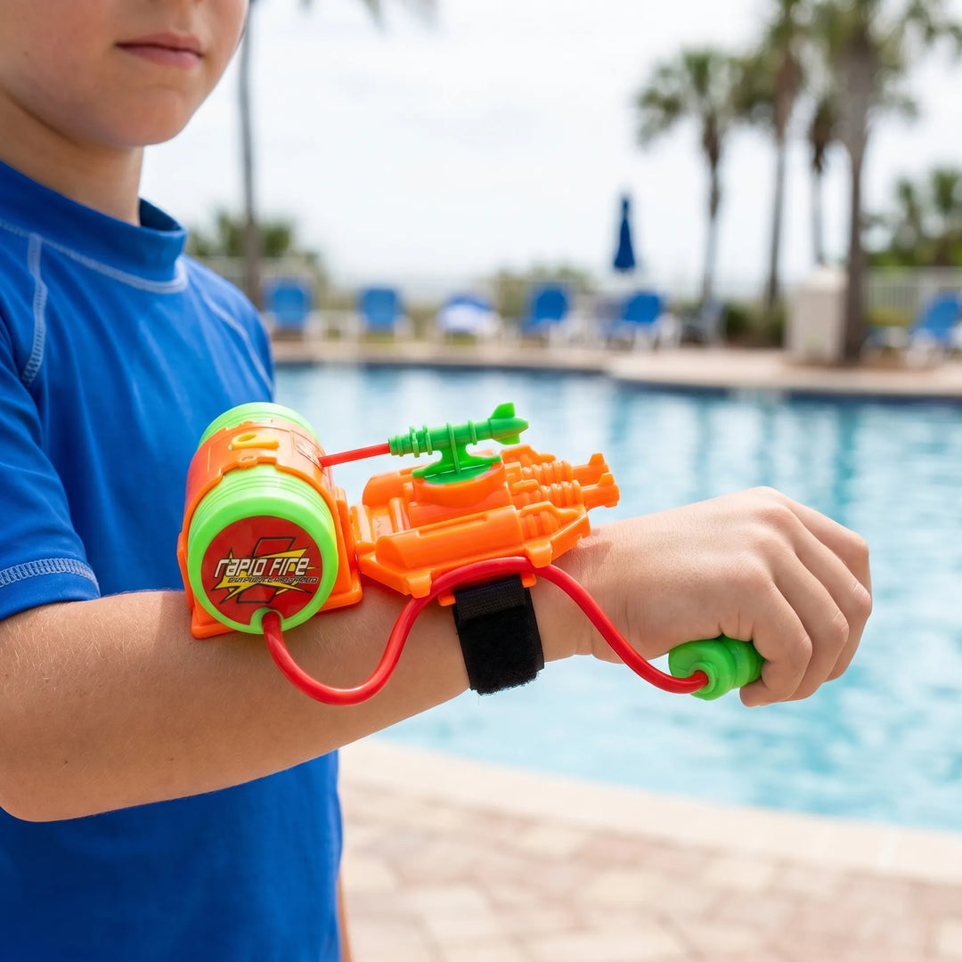 Kids' wrist-mounted water blaster for hands-free summer fun & outdoor play. Perfect children's beach toy.