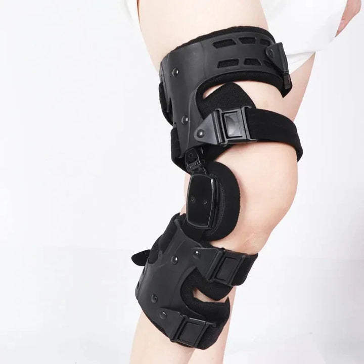 Person wearing Kneielease knee support while hiking, demonstrating active life stability & pain relief. Unisex design.