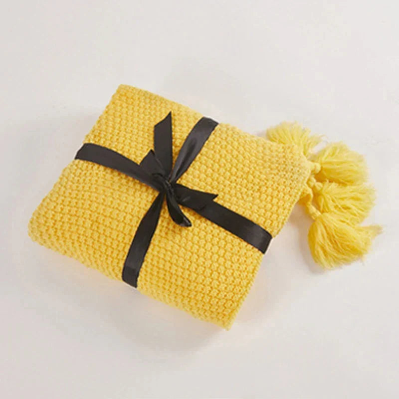 Stylish knitted wool living room throw, decorative tassels, adds comfort to your sofa.