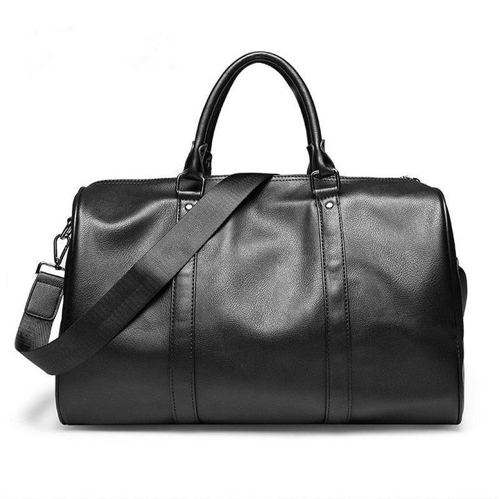 Large black faux leather travel duffel bag. Lightweight weekender with spacious interior for unisex travel.