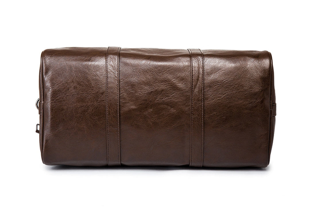 Brown lightweight faux leather gym bag. Spacious overnight duffel, perfect for unisex travel needs.