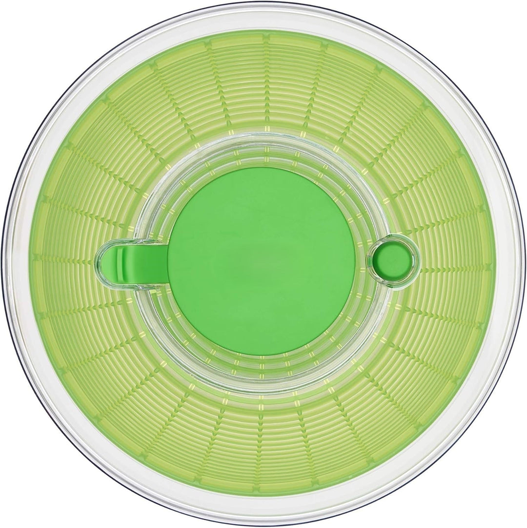 Innovative kitchen gadget: large salad spinner for efficient greens drying & washing.