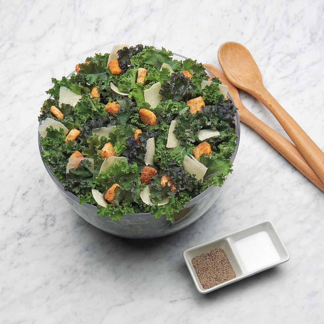 Modern kitchen tool: large salad spinner for efficient produce washing & drying.