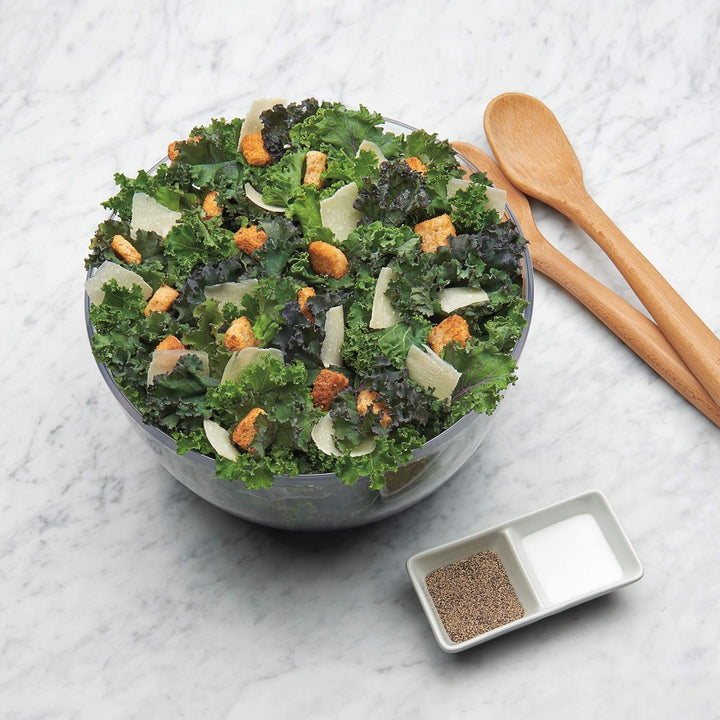 Modern kitchen tool: large salad spinner for efficient produce washing & drying.