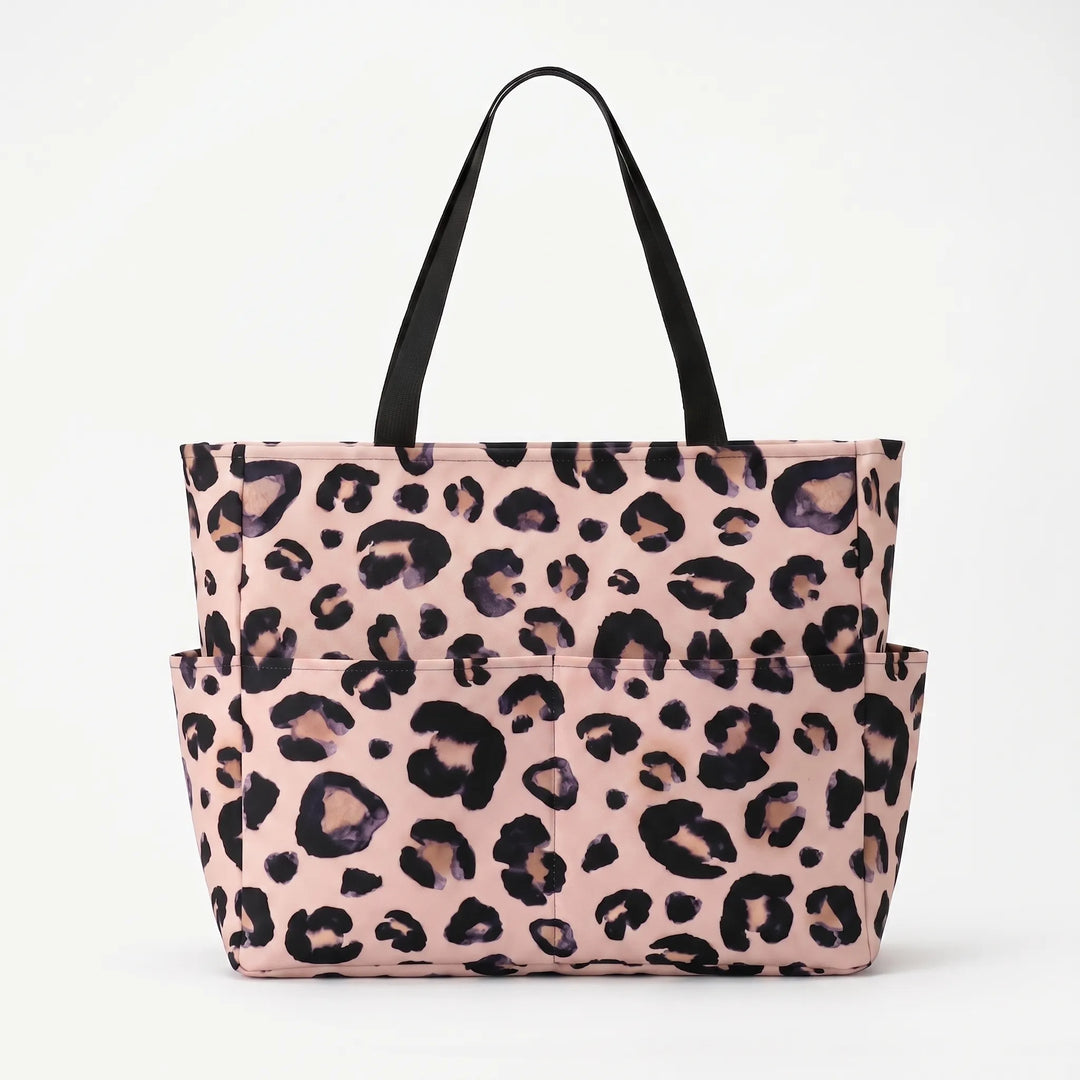 Foldable, water-resistant leopard print beach tote bag for women, great for travel.