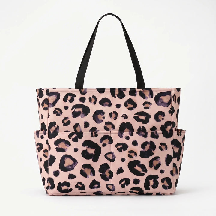 Foldable, water-resistant leopard print beach tote bag for women, great for travel.