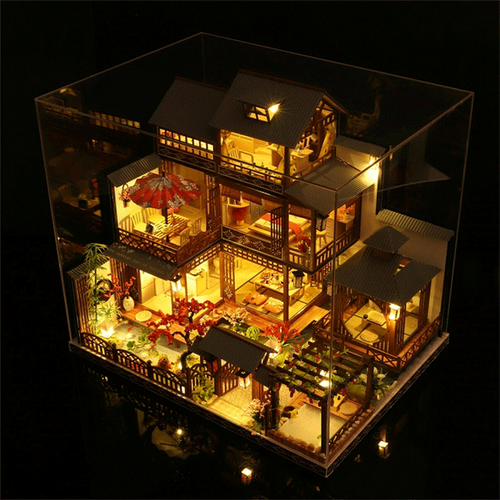DIY miniature dollhouse with working LED lights, showcasing detailed rooms for imaginative play and display.