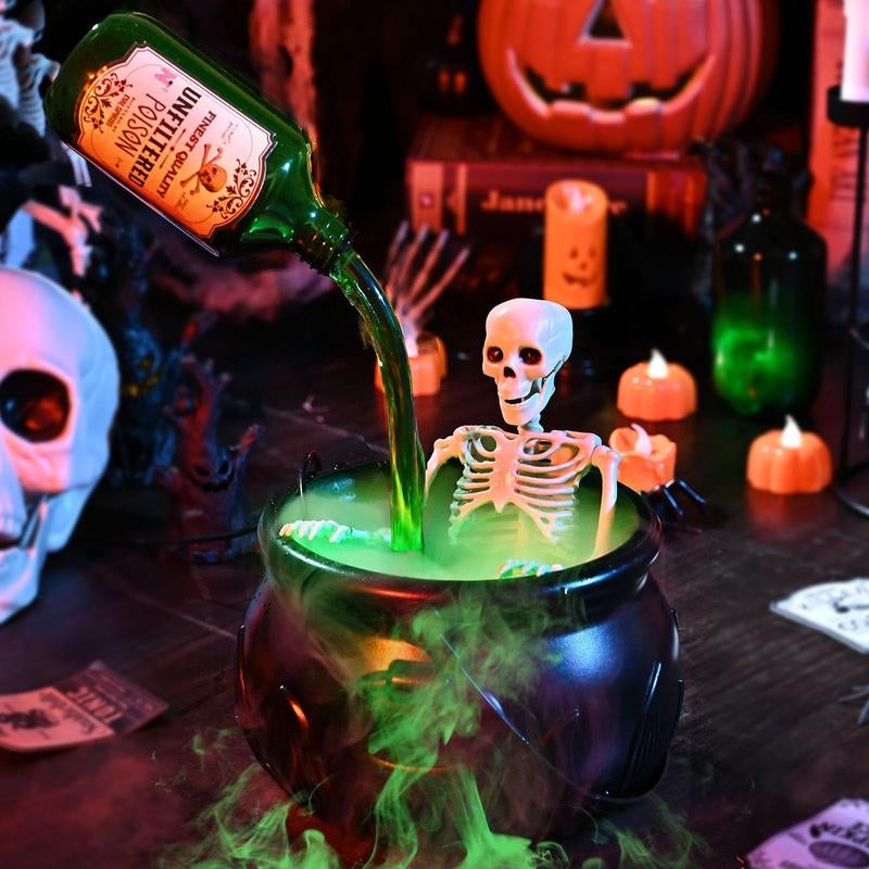 Halloween cauldron with LED light & fog effect, ideal spooky decor for parties & home ambiance.