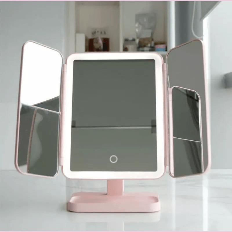 Portable LED tri-fold vanity mirror with 3 light settings, perfect for desktop beauty routines.