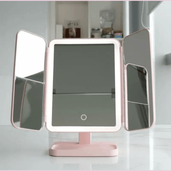 Portable LED tri-fold vanity mirror with 3 light settings, perfect for desktop beauty routines.