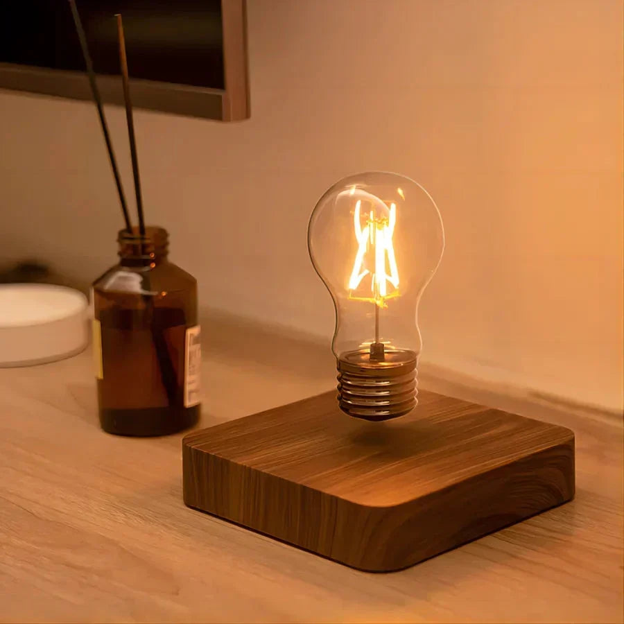 Stylish levitating desk lamp with a warm wood base, a magnetic floating light bulb enhancing modern home decor.