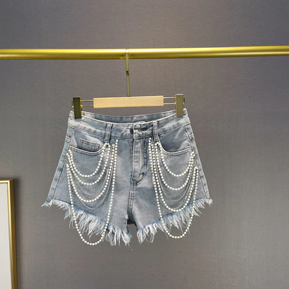 Chic light blue women's shorts with pearl & tassel details, comfortable for summer fashion & casual outings.