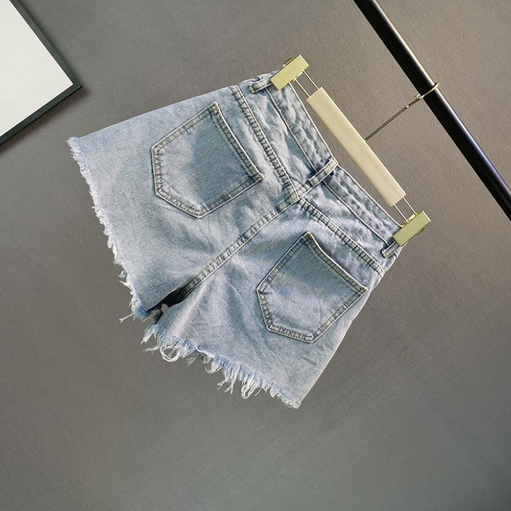 Sparkly light blue shorts for women with elegant diamond detailing, ideal for casual wear or party outfits.