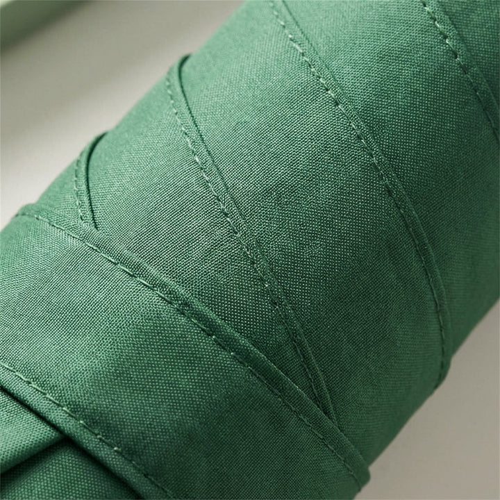 Durable light green windproof travel umbrella, perfect for protection against strong winds.