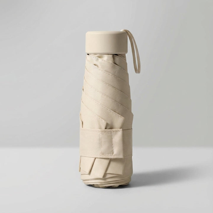 Light green windproof mini umbrella, a compact and stylish accessory for travel.