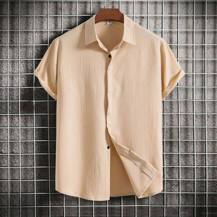 Lightweight men's button-up shirt in breathable fabric, perfect for summer casual wear & comfort.
