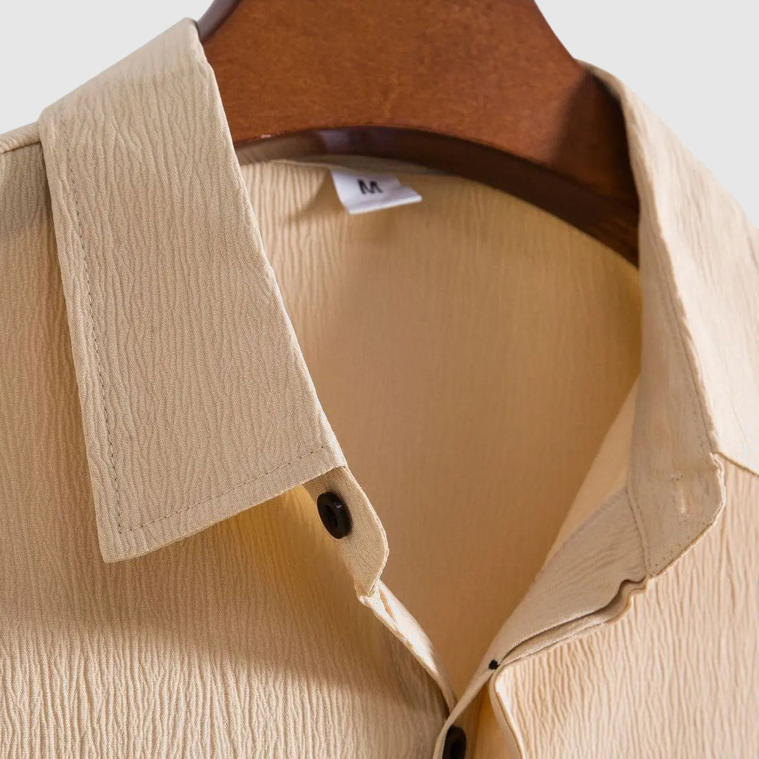 Classic men's long sleeve button-up shirt, lightweight and breathable for versatile daily wear.