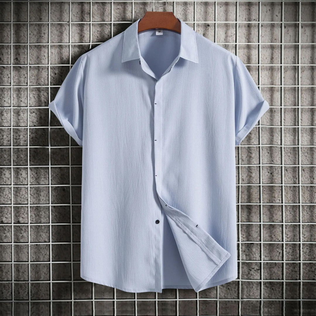 Versatile men's long sleeve button-up shirt, classic style for smart casual or formal wear.