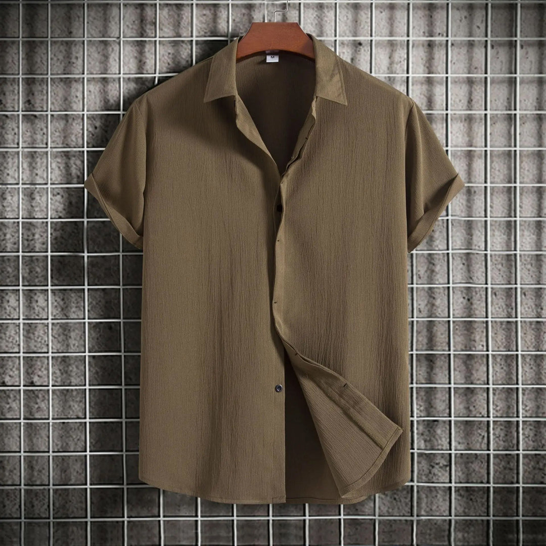 Stylish men's lightweight button-up shirt, perfect long sleeve breathable top for summer fashion.