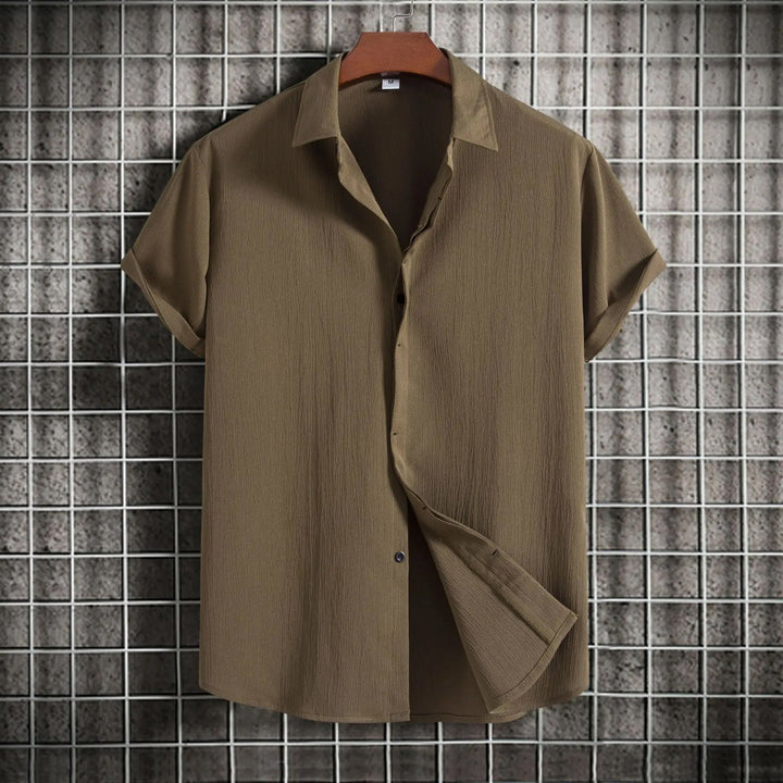 Stylish men's lightweight button-up shirt, perfect long sleeve breathable top for summer fashion.