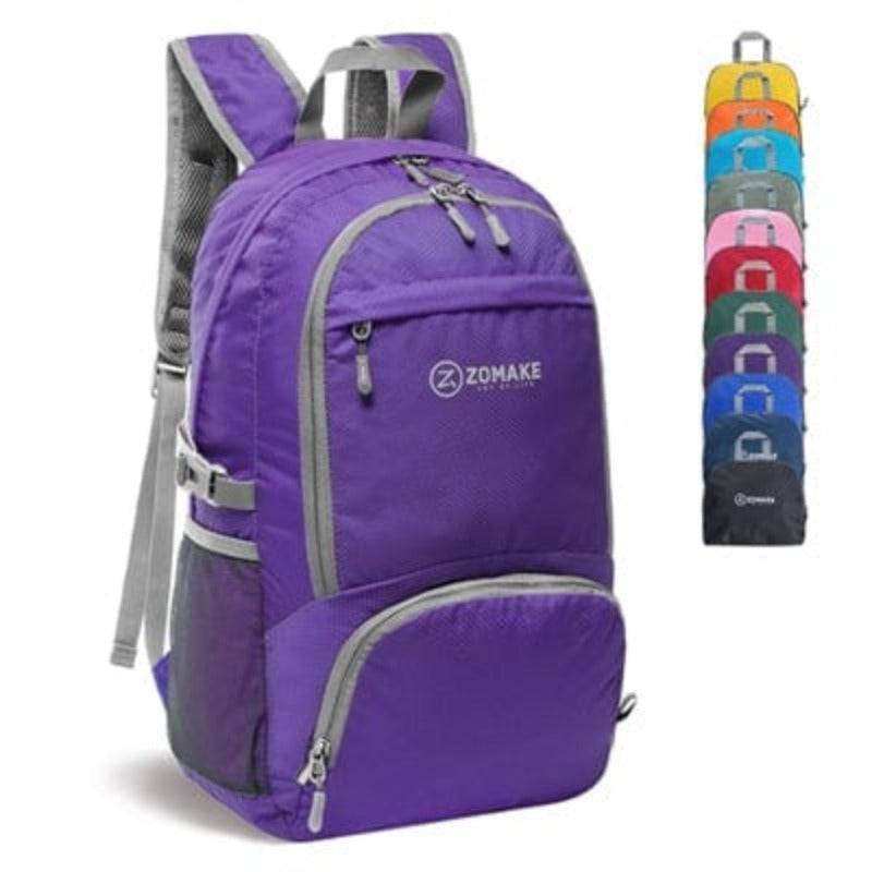 Outdoor scene with a packable travel bag on rocks, emphasizing its rugged versatility.