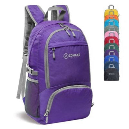 Outdoor scene with a packable travel bag on rocks, emphasizing its rugged versatility.