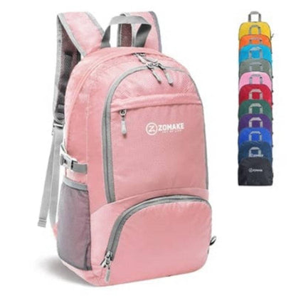 Group of packable backpacks stacked, showing variety of colors, essential for travel & hiking.