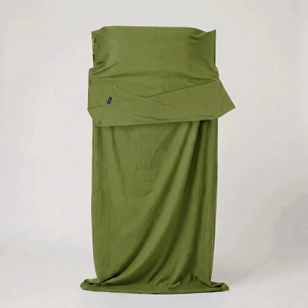 Compact hostel essential: a lightweight travel sleeping bag liner for hygienic and comfortable stays.