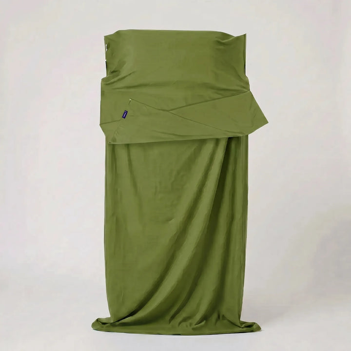 Compact hostel essential: a lightweight travel sleeping bag liner for hygienic and comfortable stays.
