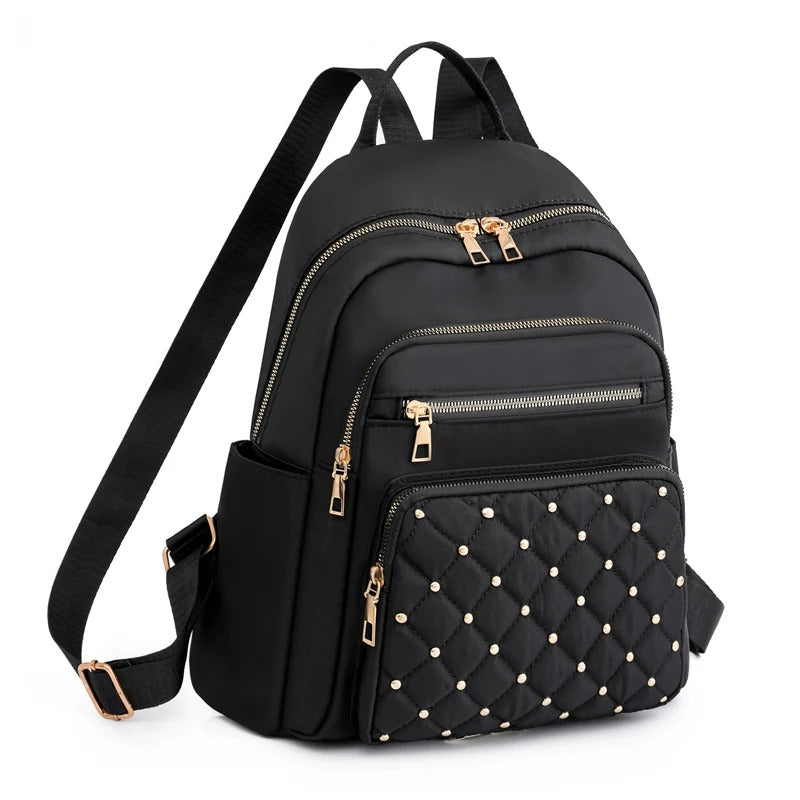 Lightweight water-resistant nylon women's backpack, ideal for daily school use & travel.