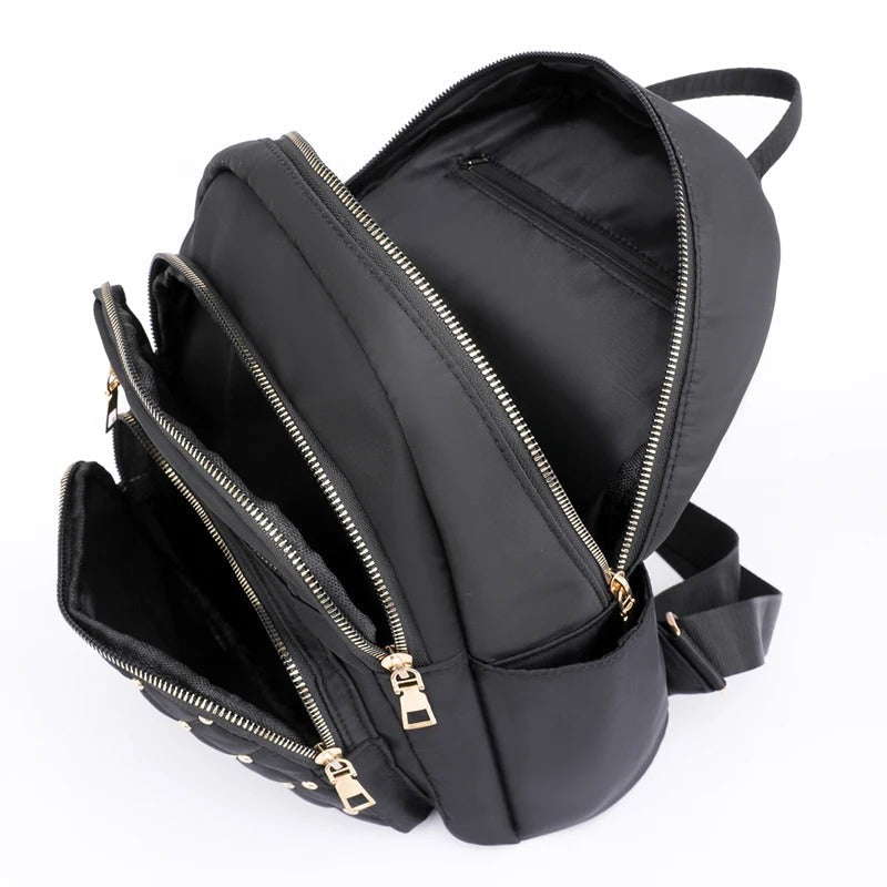 Durable water-resistant nylon travel backpack for women, lightweight for comfortable journeys.