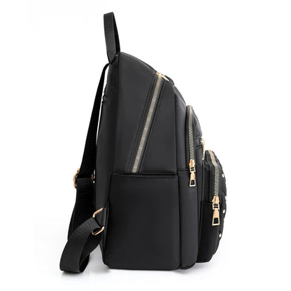 Versatile black nylon women's backpack, lightweight and water-resistant for stylish daily commutes.