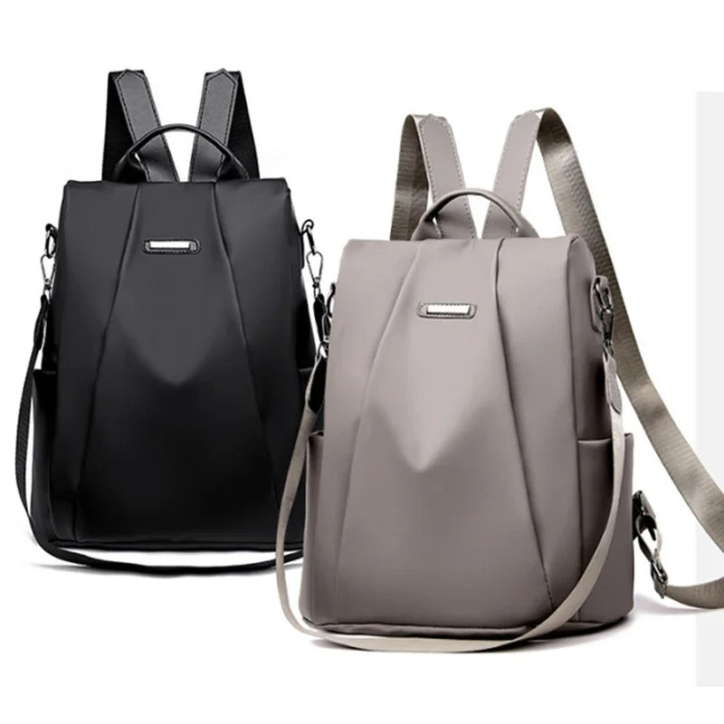 Traveler with a sleek, lightweight water-resistant nylon backpack, perfect for trips. Multi-way carry travel bag.