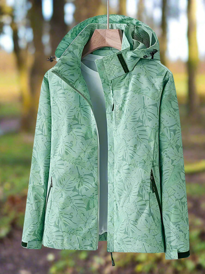 Lightweight waterproof women's summer jacket with stylish green leaf print.