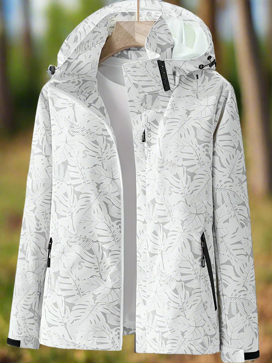 Versatile women's windbreaker, waterproof & lightweight, featuring a chic leaf print for activewear.