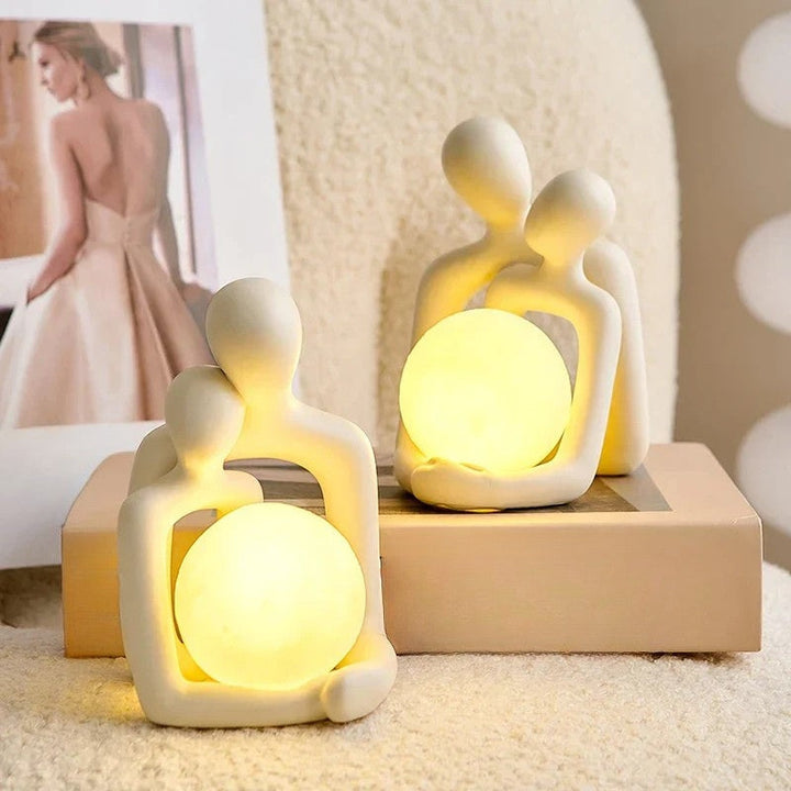 LunaGlow ceramic mood lamp, a stylish table lamp providing ambient lighting for a cozy bedroom or living room accent.