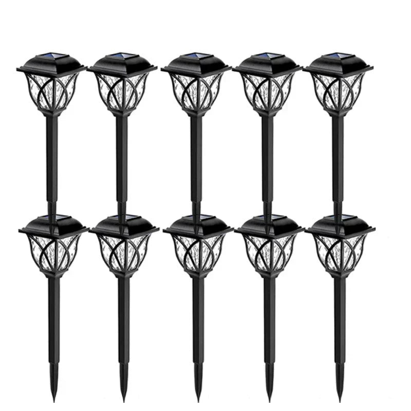 Unisex LunaGlow solar garden path lights glowing in a flower bed, enhancing outdoor living spaces with sustainable LED.
