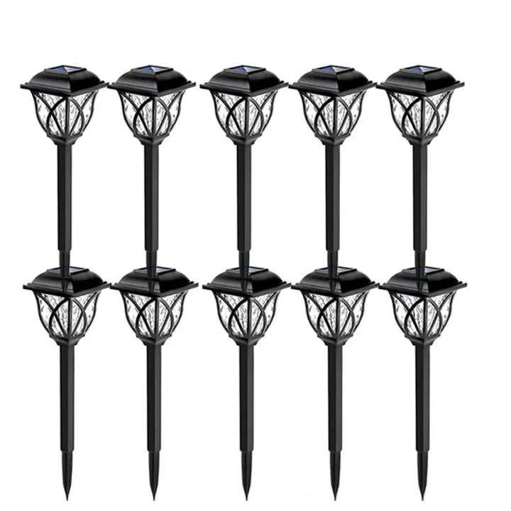 Unisex LunaGlow solar garden path lights glowing in a flower bed, enhancing outdoor living spaces with sustainable LED.