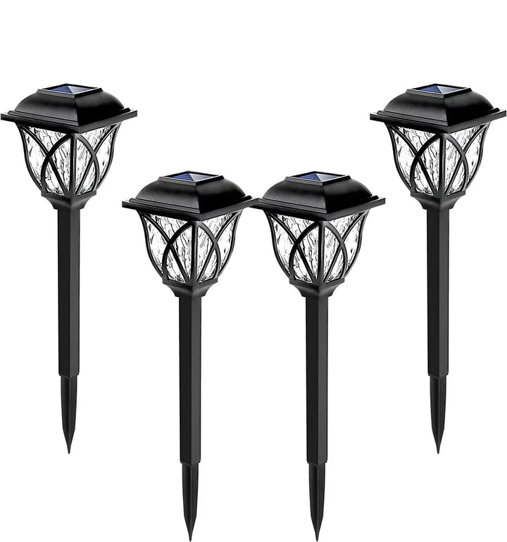 Multiple LunaGlow solar garden path lights creating a beautiful illumination along a driveway or garden border.