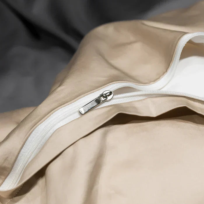 Elegant embroidered satin cotton pillowcases, part of a comfortable and luxurious year-round bedding set.