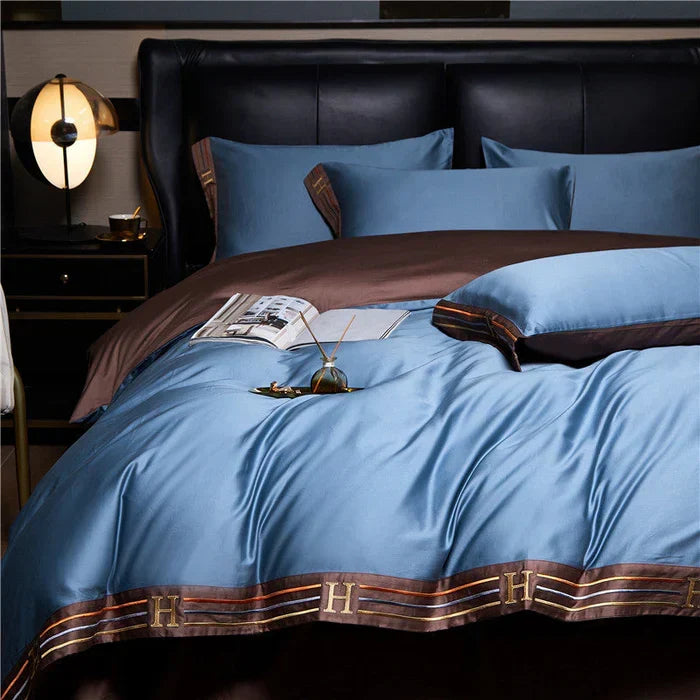 A sophisticated bedroom featuring a complete luxury embroidered satin cotton bedding set for ultimate comfort.