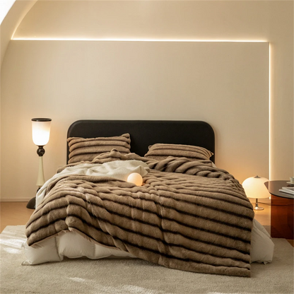 Cozy faux fur throw blanket, perfect for snuggling in living room or bedroom, adding warmth & style.