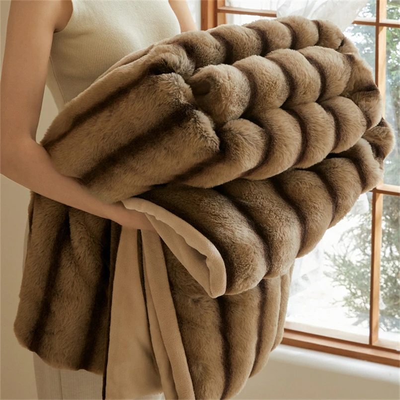 Plush, soft faux rabbit fur throw blanket, adds luxury and warmth to any home decor setting.