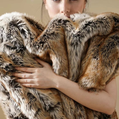 Cozy faux fur throw blanket, ideal for sofas and beds. Ultra-soft luxury for a warm and inviting home.