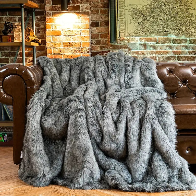 Decorative faux fur throw blanket, soft and luxurious, enhancing any room with cozy, elegant living style.