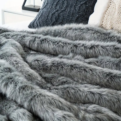 Plush faux fur throw blanket, ultra-soft and luxurious. A cozy home decor essential for elegant comfort.