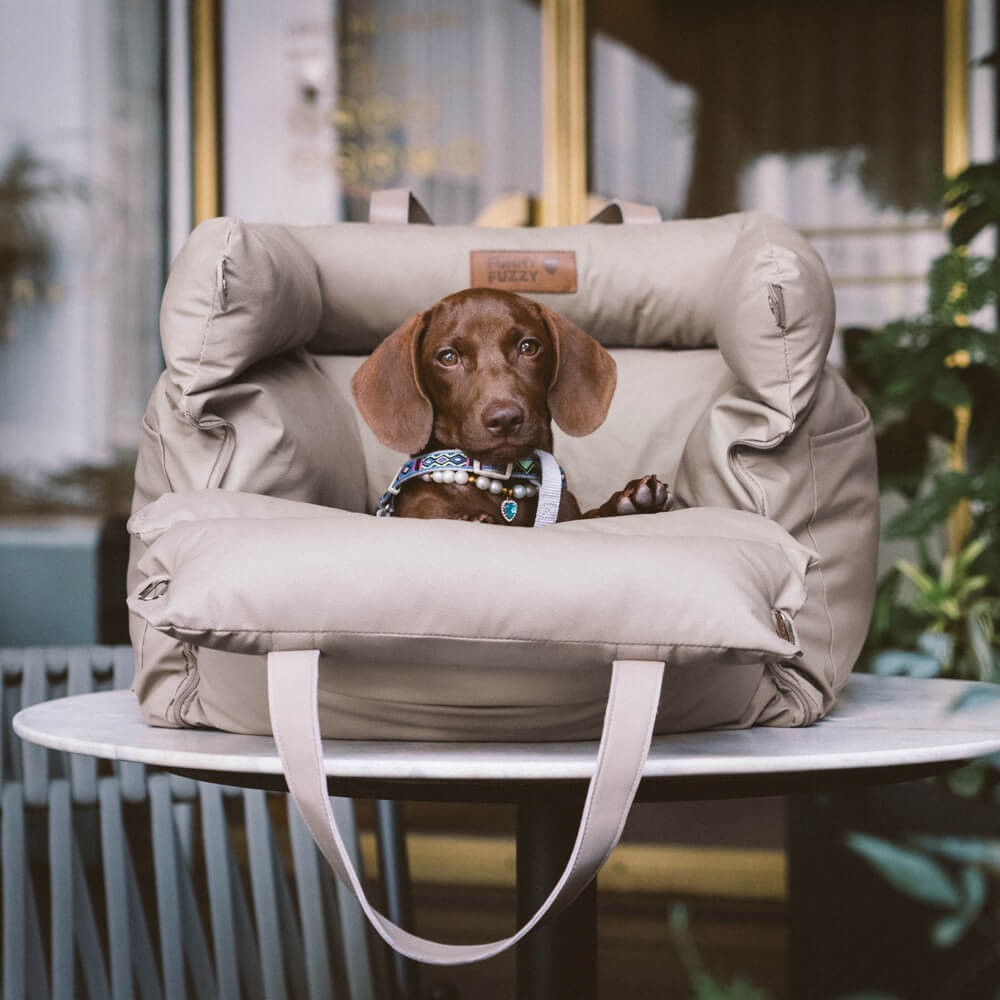 Soft faux leather dog booster for comfortable and safe car journeys.