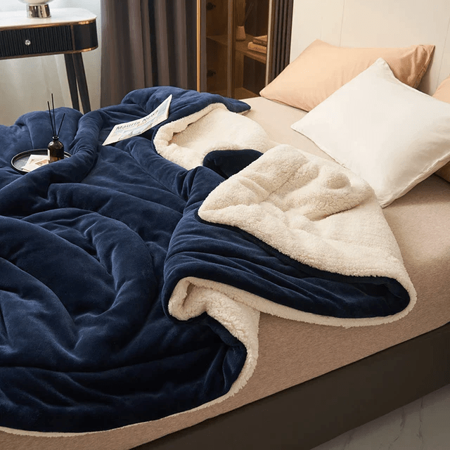 Velvety soft fleece blanket, a luxurious bedroom accessory providing warmth & cozy comfort.