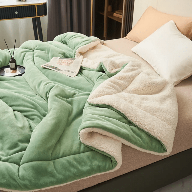 Snuggle into this cozy fleece blanket, a plush bedroom accessory for warmth and luxurious comfort.